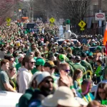 Kentucky woman dies after being dragged under Louisville parade float