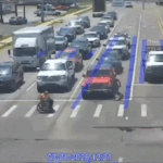 Driver wearing Spider-Man costume helps man in wheelchair cross street in Arkansas